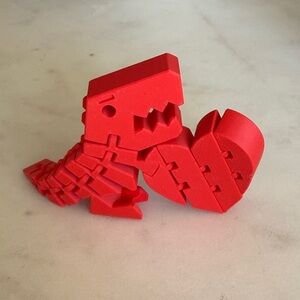 3D Printed Red Dinosaur Heart Flex Fidget Toy